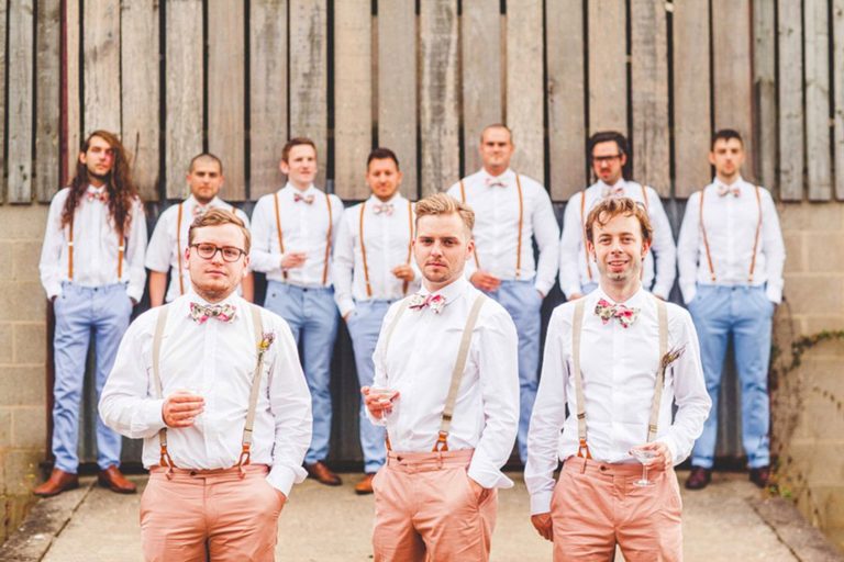 Unique groom and groomsmen attire with pastels bow ties