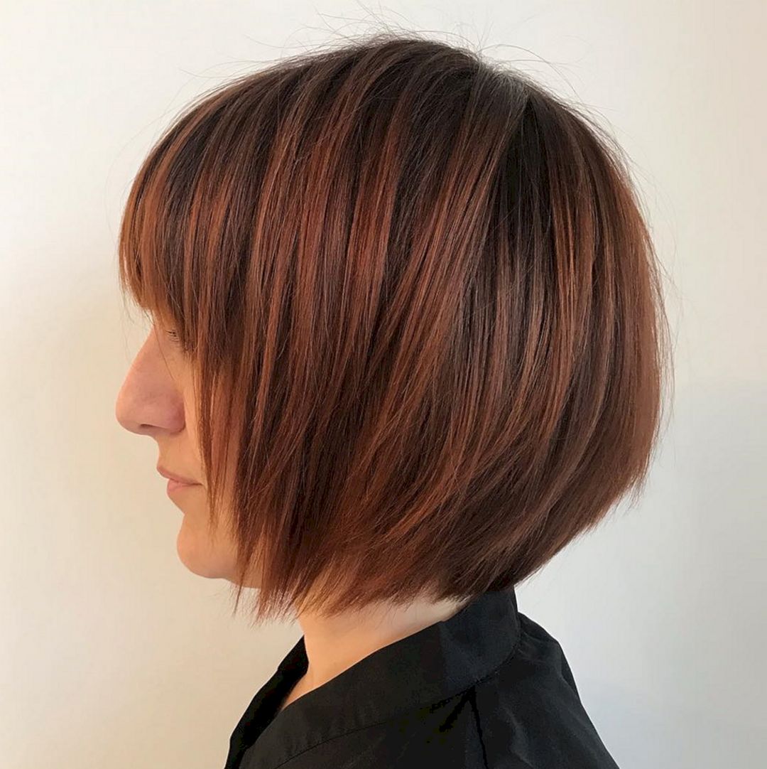 Bob cut with a deep shade of copper from hairstylery