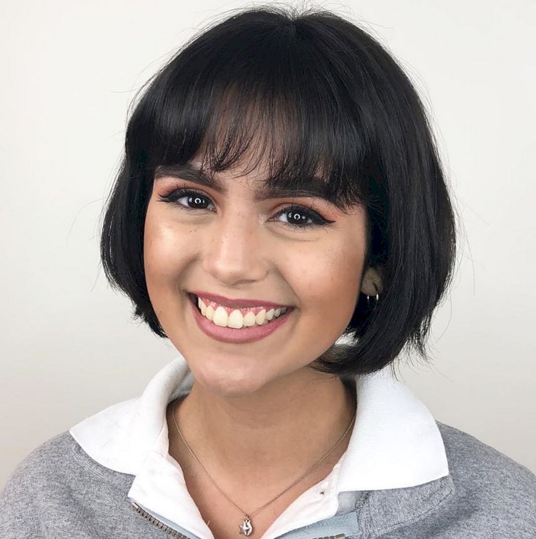 Classic bob with round-brushed styling and soft bangs from hairstylery