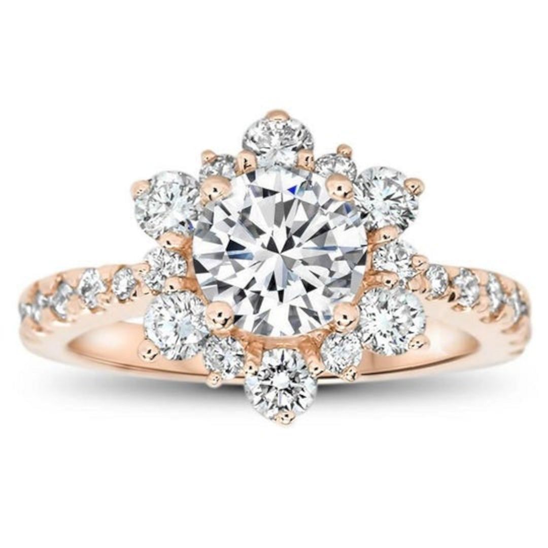 Rose gold snowflake inspired diamond halo moissanite engagement ring from serenadediamonds