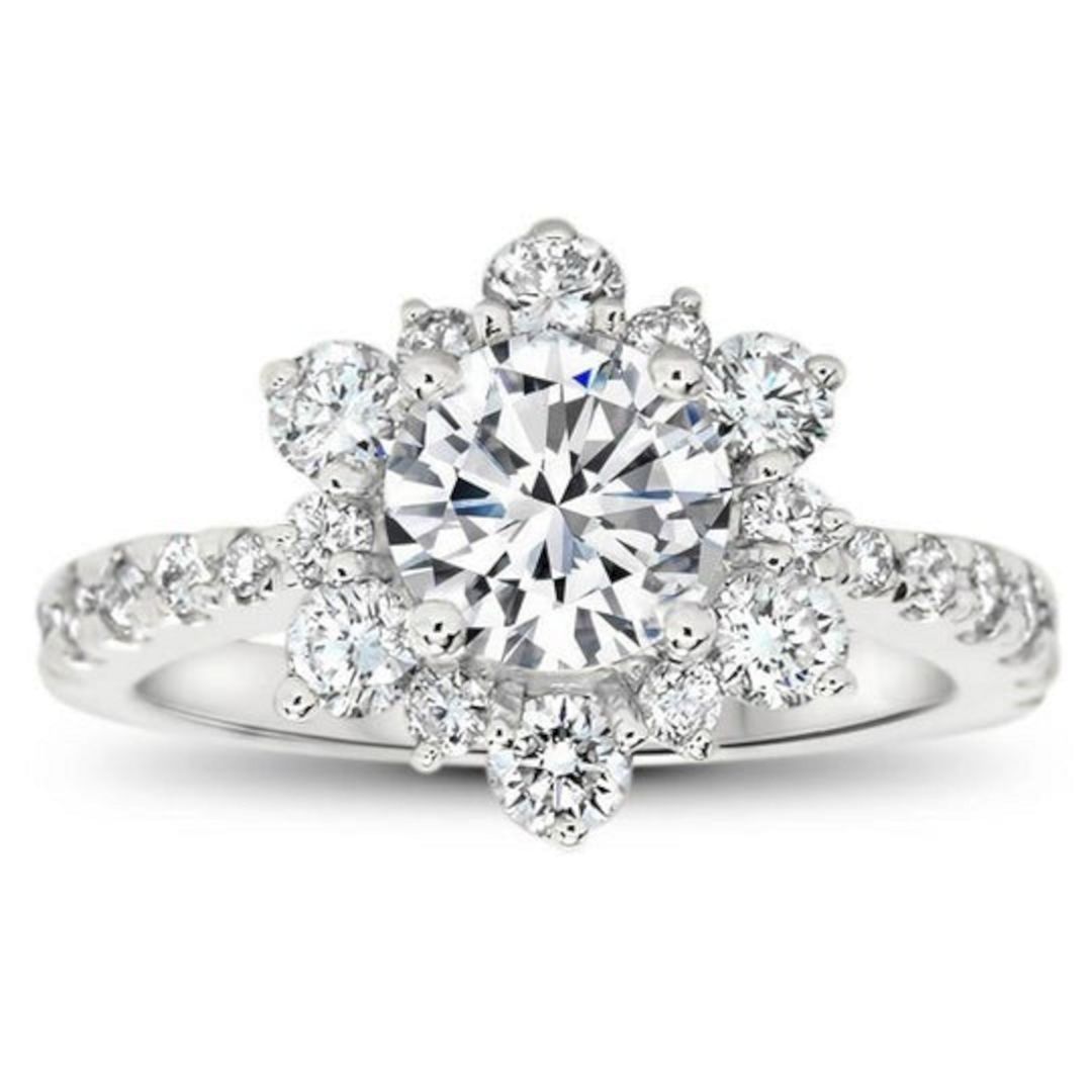 Snowflake inspired diamond halo moissanite wedding from serenadediamonds
